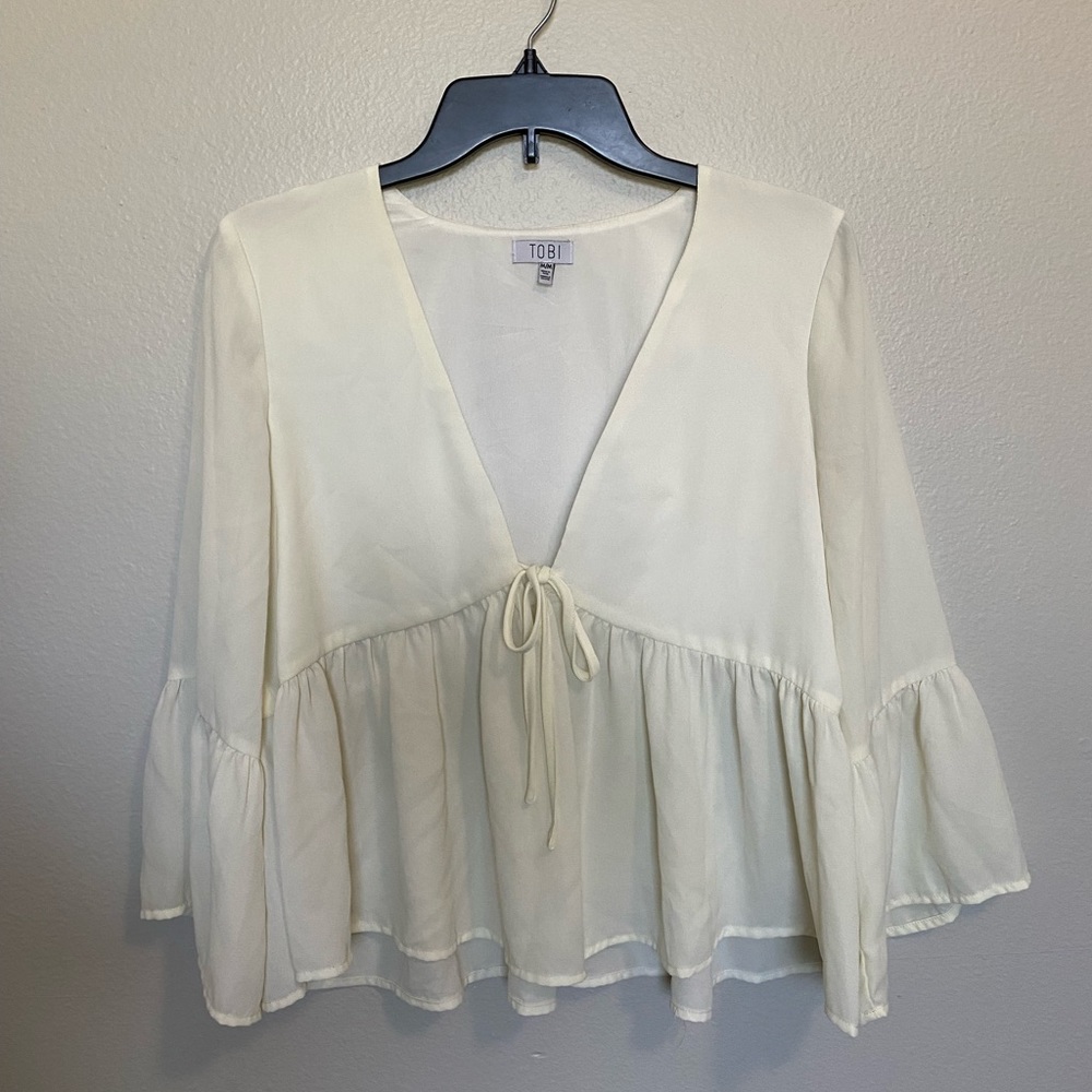 Tobi white tie front blouse with flared sleeves. Size M